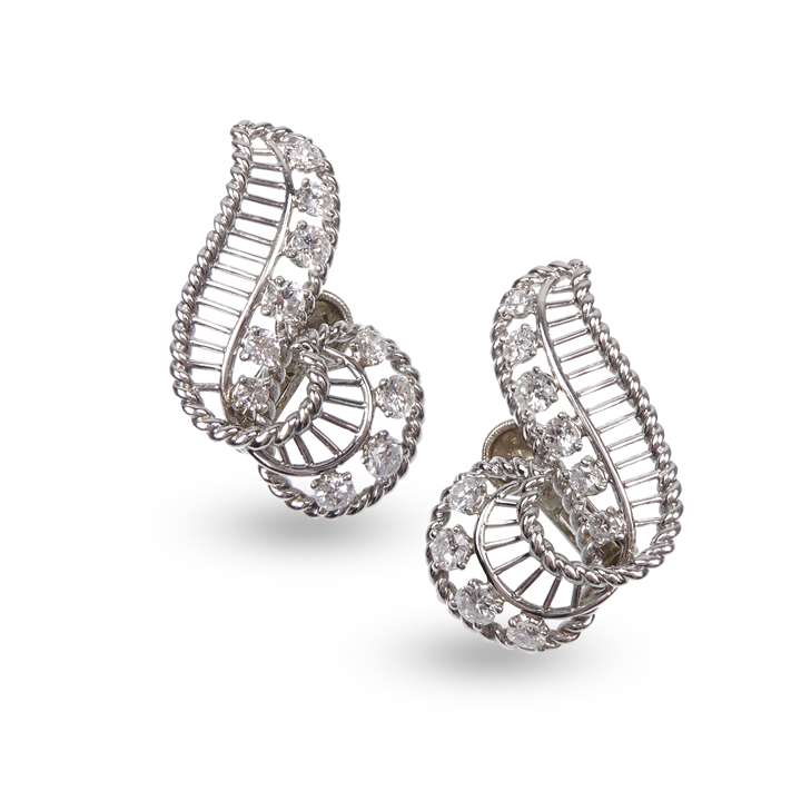 Pair of diamond and wirework scroll earrings of stylised treble clef form